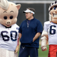 Patriots head coach Bill Belichick watches private workouts of mascot prospects Mr. Pig and Scarlet Knight in March.